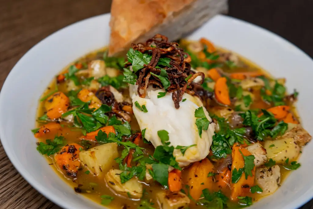 Broth Poached Cod with Herby Roasted Vegetables & Crispy Shallots